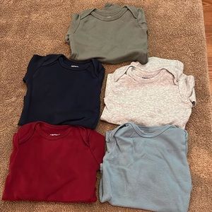 Carter’s solid color long sleeve onesies